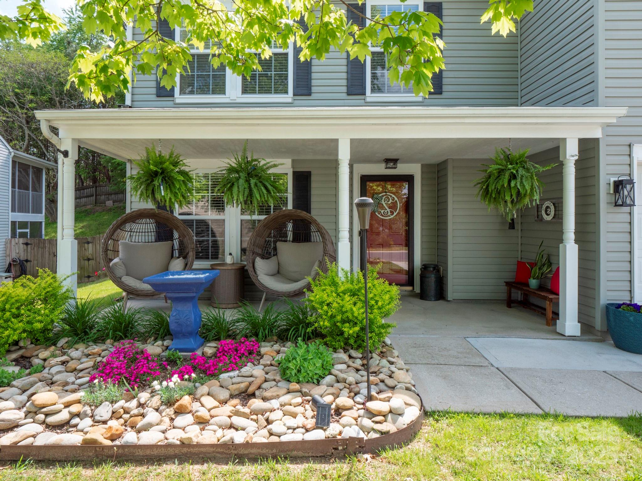 4148 Shasta Circle Clover, SC 29710 - Photo 2 of 48 a front view of a house with lots of potted plants