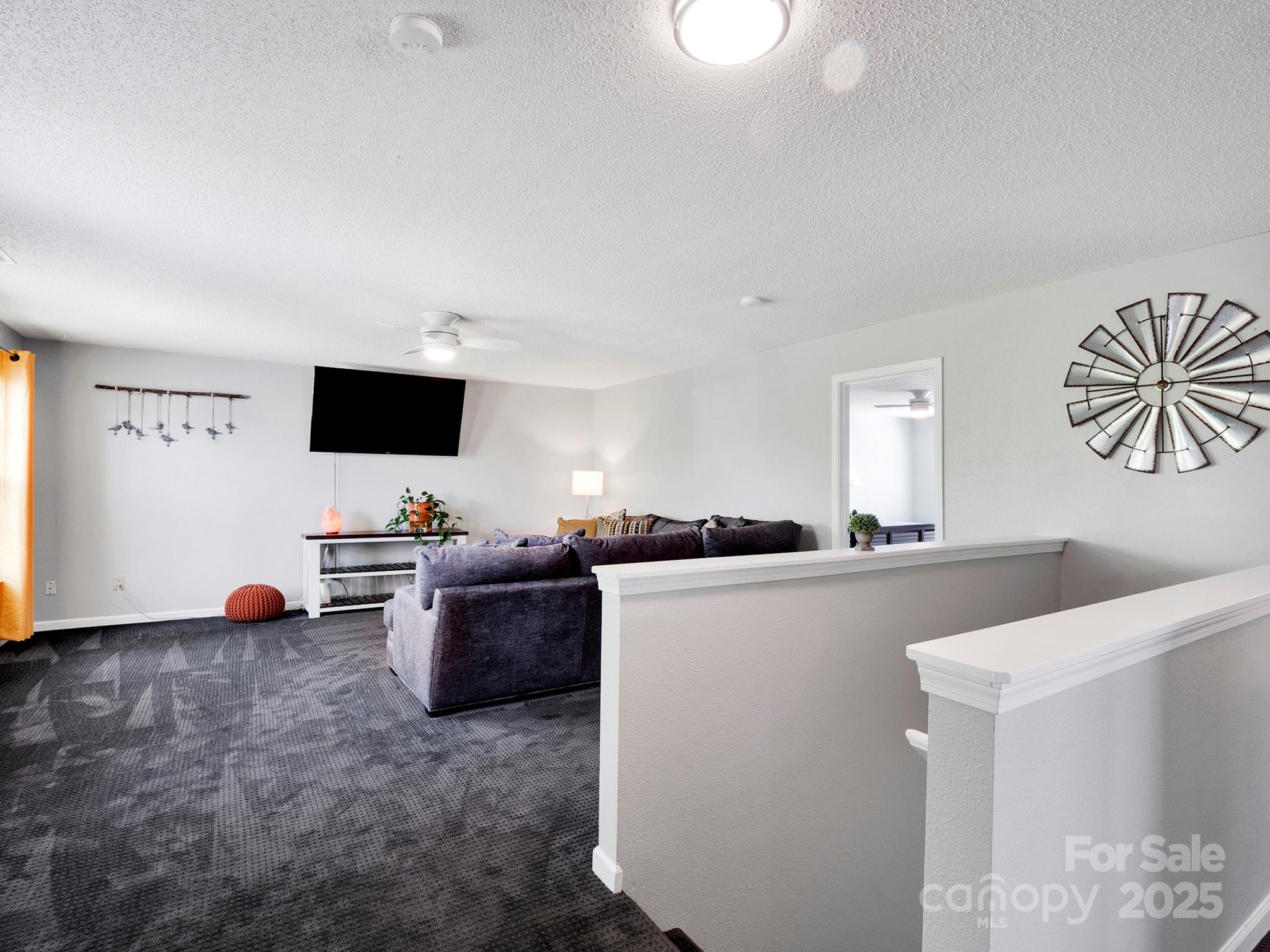 4148 Shasta Circle Clover, SC 29710 - Photo 27 of 48 a living room with furniture and a flat screen tv