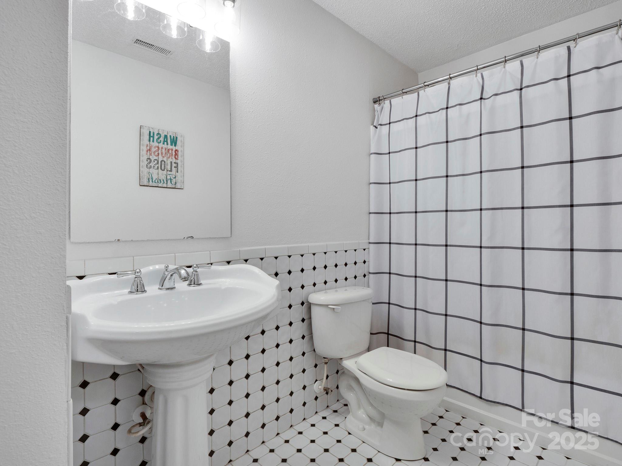 4148 Shasta Circle Clover, SC 29710 - Photo 36 of 48 a bathroom with a sink toilet and shower