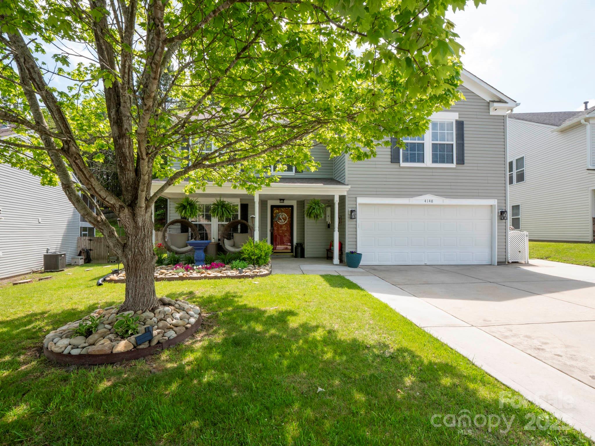 4148 Shasta Circle Clover, SC 29710 - Photo 44 of 48 a front view of a house with a yard and porch