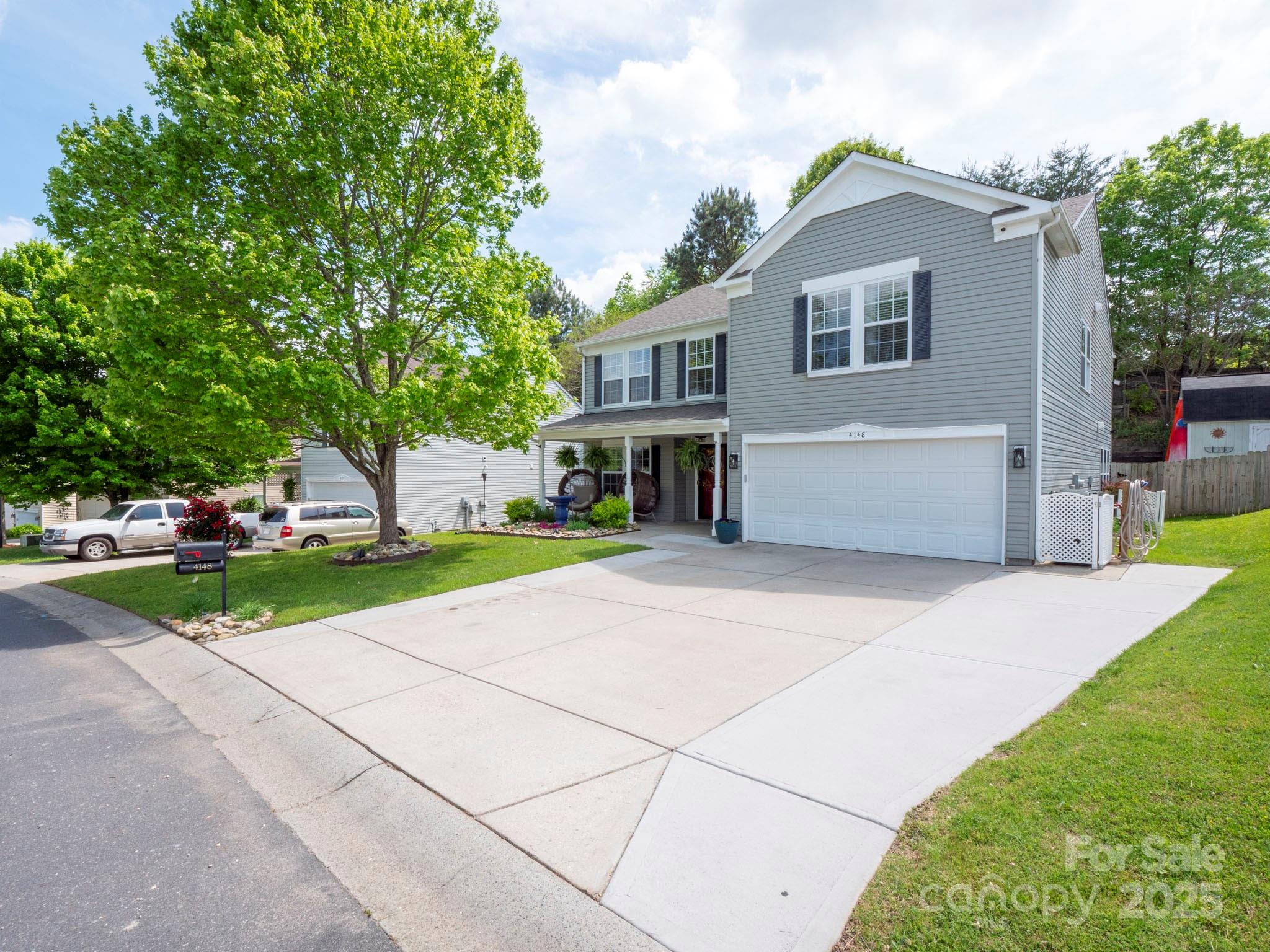 4148 Shasta Circle Clover, SC 29710 - Photo 46 of 48 a front view of a house with a yard and garage