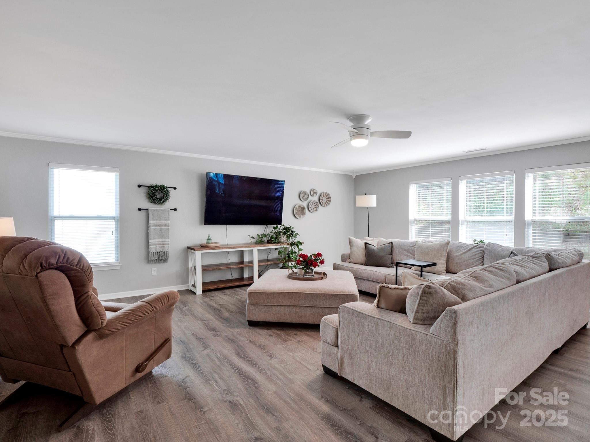 4148 Shasta Circle Clover, SC 29710 - Photo 9 of 48 a living room with furniture flat screen tv and a large window