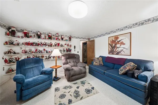 a view of a room with furniture and a window