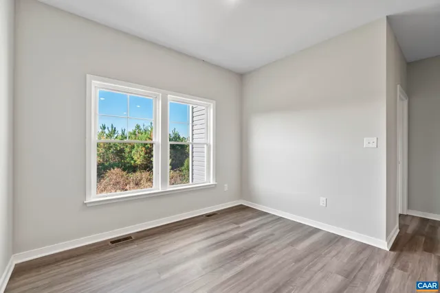 a kitchen with kitchen island granite countertop a sink wooden cabinets and stainless steel appliances