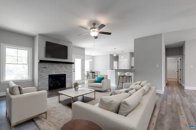 a view of a kitchen with a wooden floor and a kitchen island