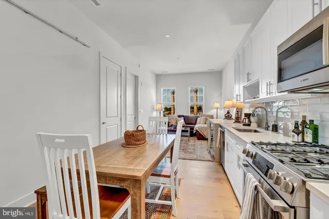 a kitchen with a stove and a microwave