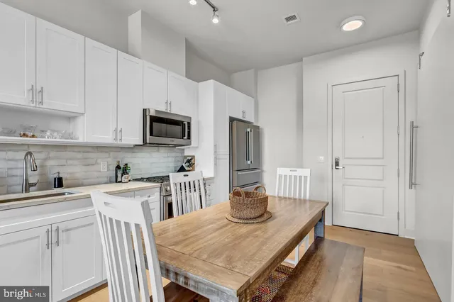 a living room with furniture rug and window