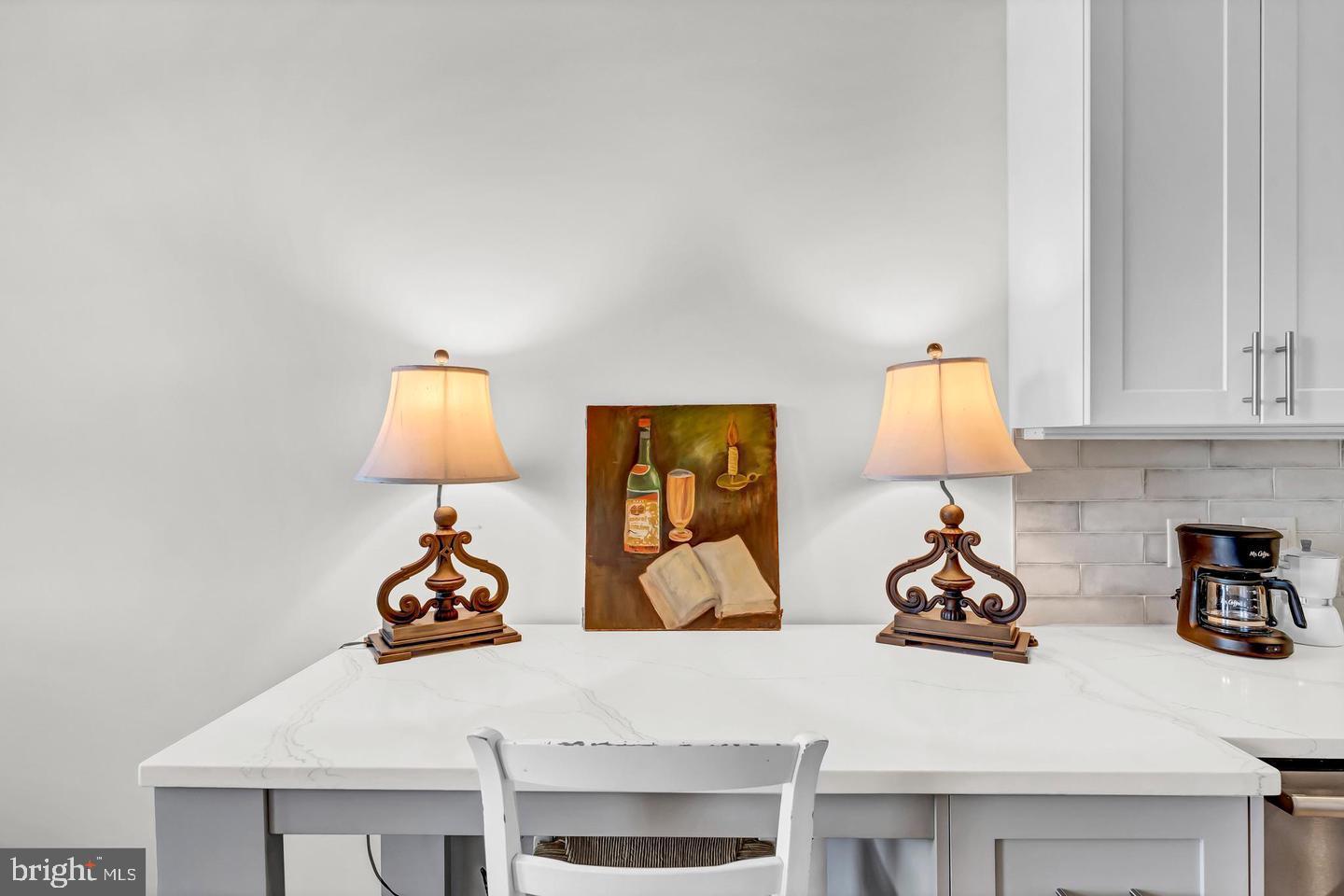 6803 Cameron Drive Northwest, Unit 514 Washington, DC 20012 - Photo 20 of 50 a view of a kitchen with sink and a bed