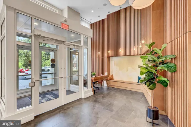 a view of an entryway with wooden floor