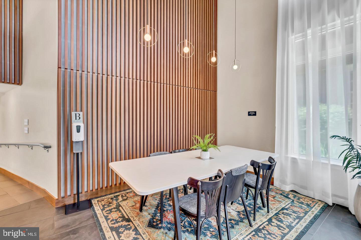 6803 Cameron Drive Northwest, Unit 514 Washington, DC 20012 - Photo 44 of 50 a view of a dining room with furniture and wooden floor