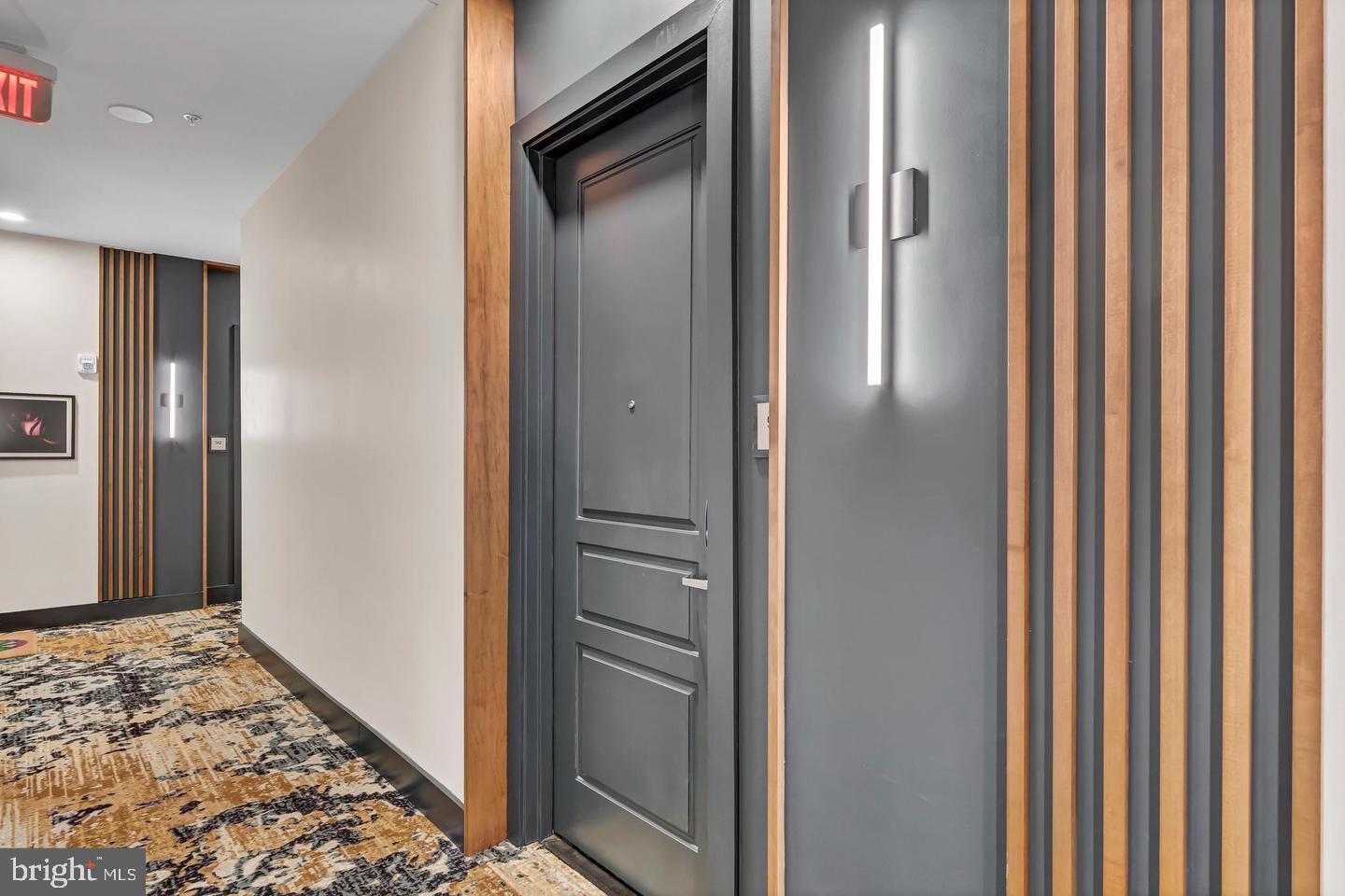 6803 Cameron Drive Northwest, Unit 514 Washington, DC 20012 - Photo 6 of 50 a view of elevator with wooden floor