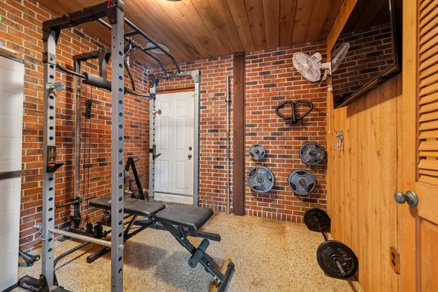 an aerial view of a house with a yard basket ball court and outdoor seating