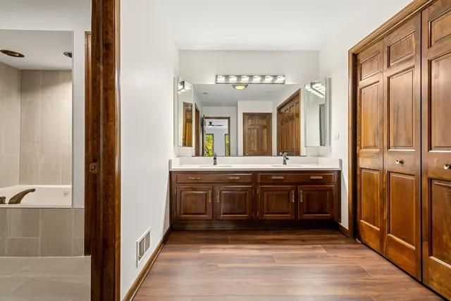 a bathroom with a tub and a shower