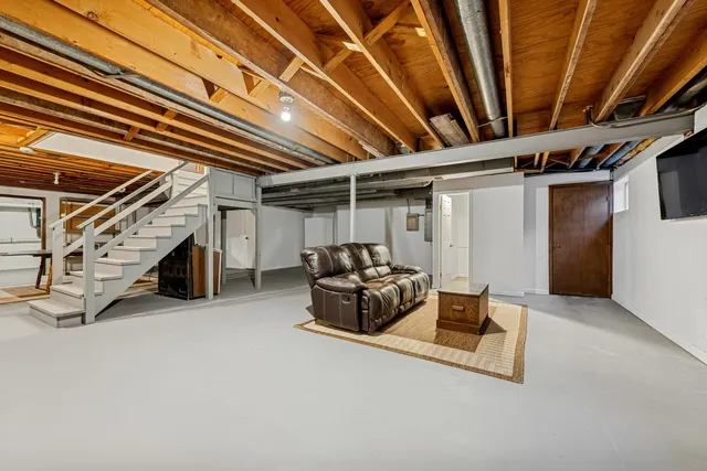 an aerial view of a houses with a yard