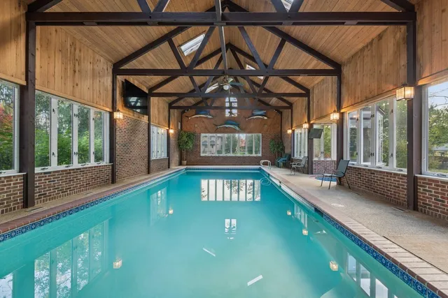a view of a swimming pool with a porch
