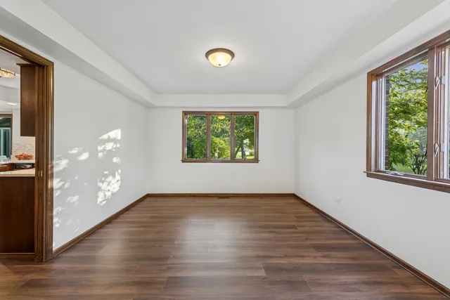 a view of livingroom with furniture wooden floor and windows