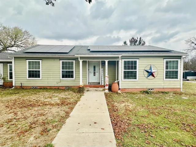 front view of a house with a large window