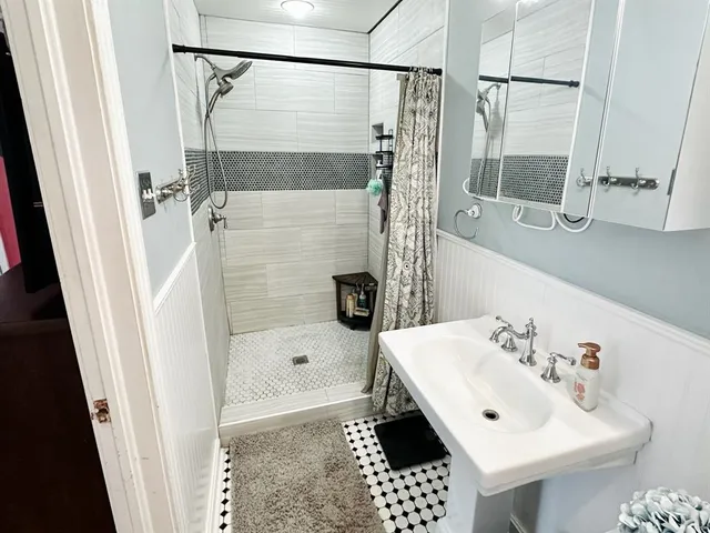 a bathroom with a sink and a mirror