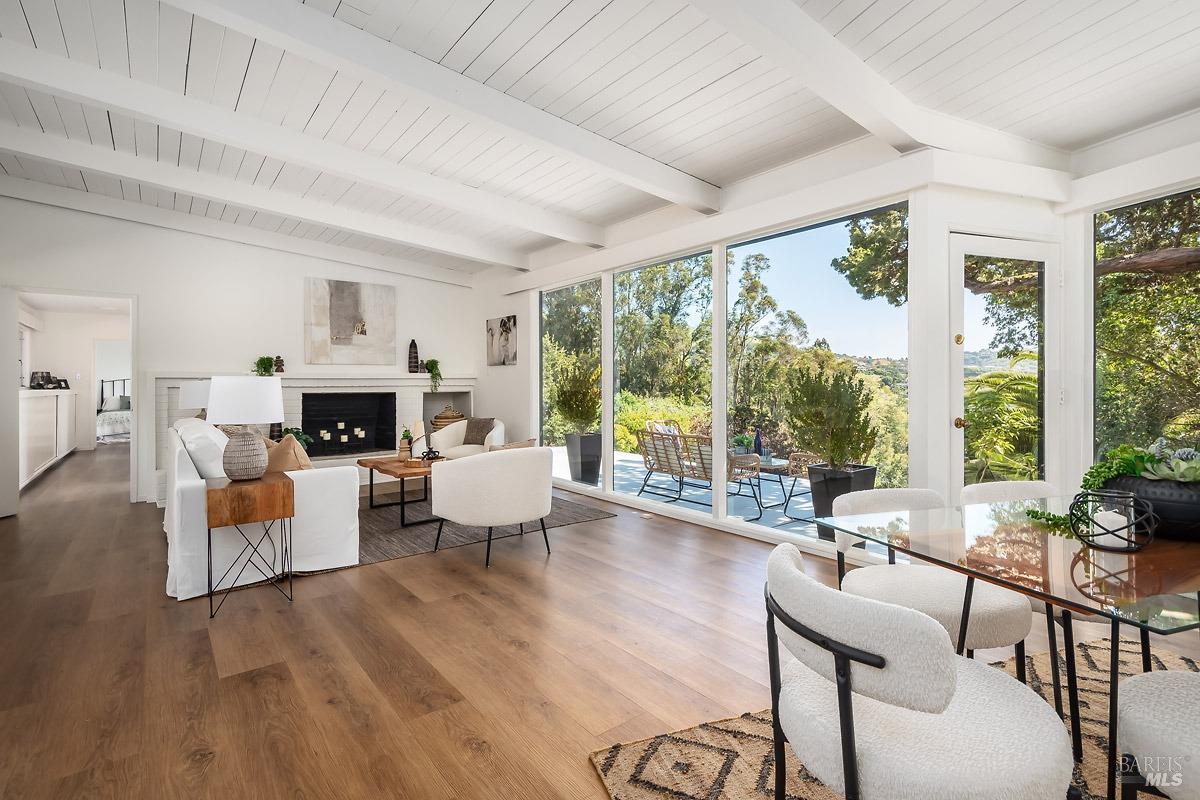 40 Montecito Road San Rafael, CA 94901 - Photo 1 of 1 a living room with furniture fireplace and a large window