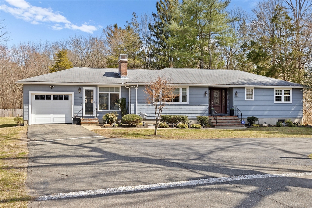1368 Bay Road Stoughton, MA 02072 - Photo 1 of 42 a front view of a house with a garden
