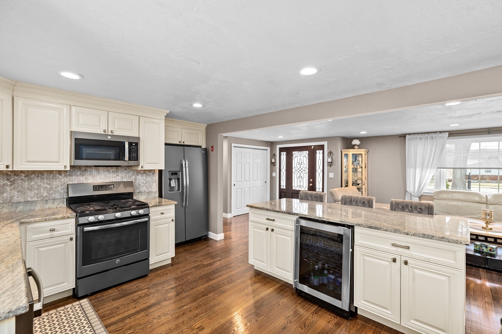 1368 Bay Road Stoughton, MA 02072 - Photo 17 of 42 a kitchen with white cabinets stainless steel appliances and sink