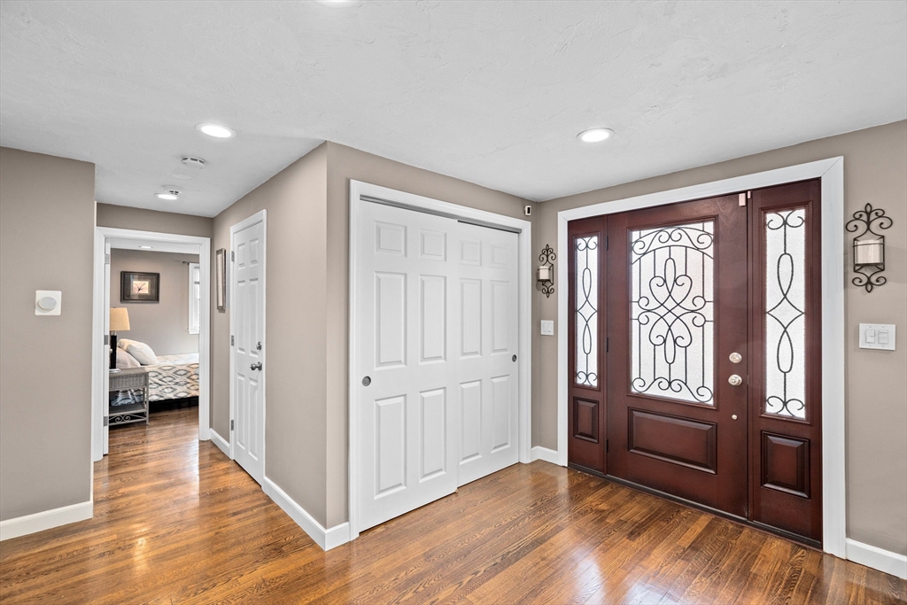 1368 Bay Road Stoughton, MA 02072 - Photo 19 of 42 a view of a hallway with wooden floor and windows