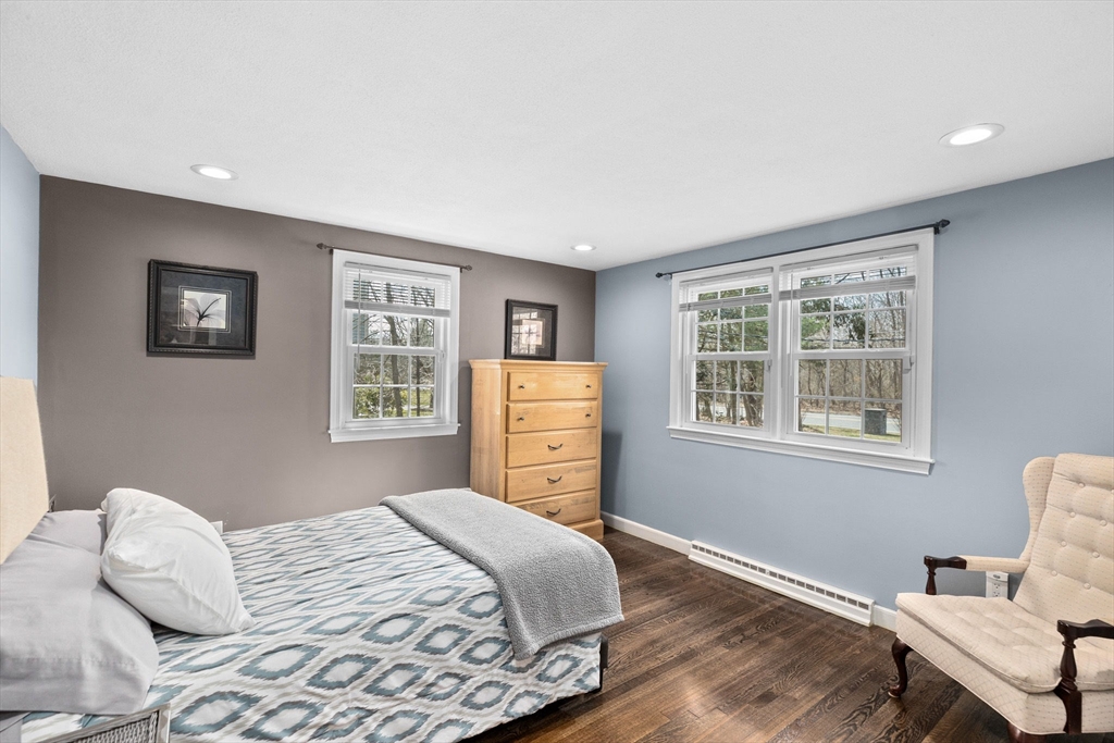 1368 Bay Road Stoughton, MA 02072 - Photo 23 of 42 a bedroom with a bed and wooden floor