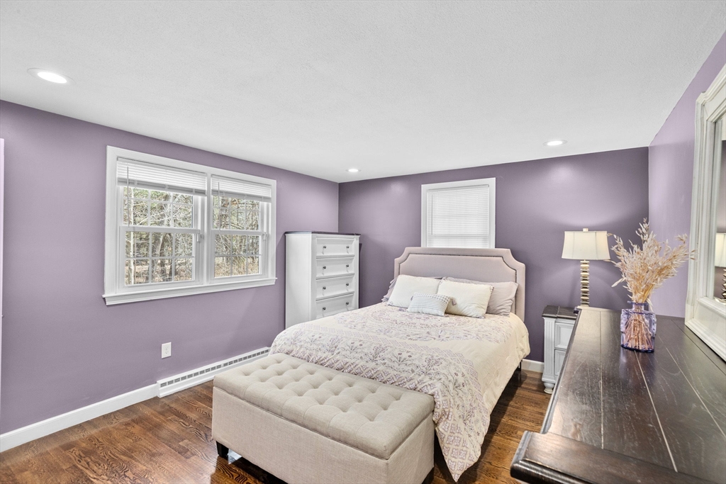 1368 Bay Road Stoughton, MA 02072 - Photo 25 of 42 a bedroom with a bed and wooden floor