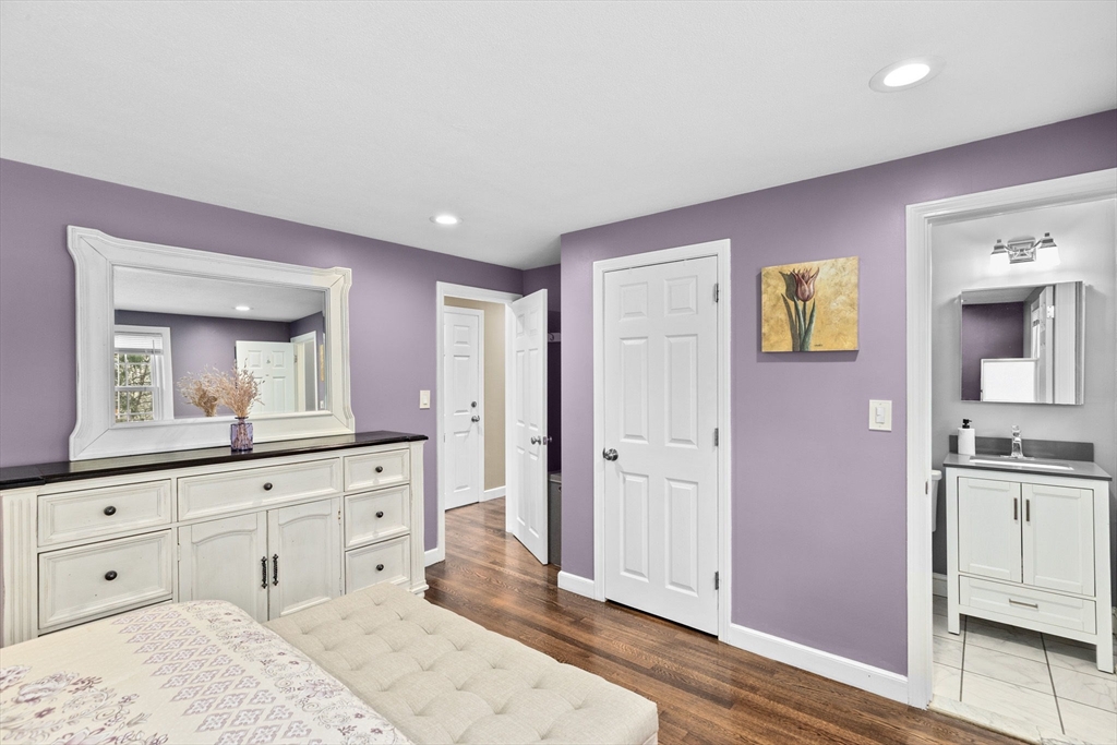 1368 Bay Road Stoughton, MA 02072 - Photo 27 of 42 a spacious bathroom with a granite countertop sink and a mirror