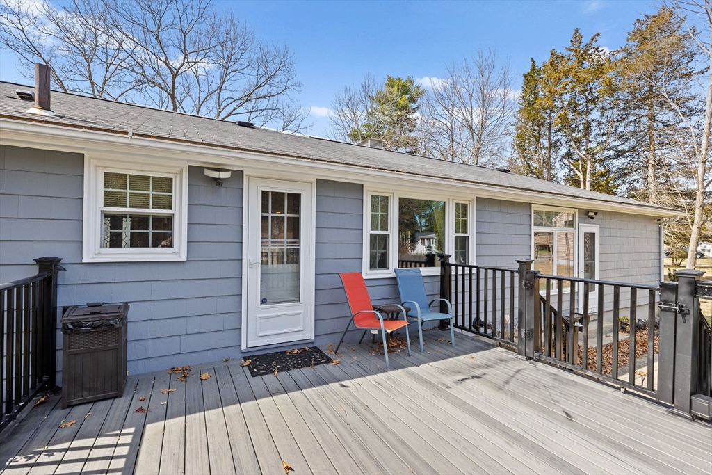 1368 Bay Road Stoughton, MA 02072 - Photo 30 of 42 a view of a wooden deck with a bench
