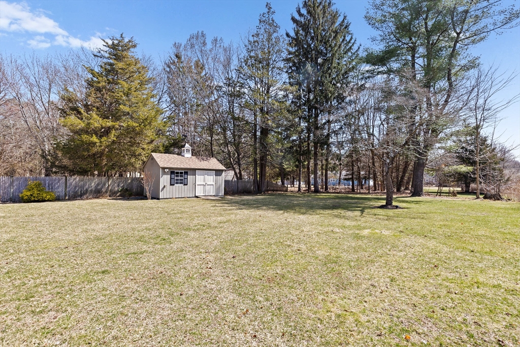 1368 Bay Road Stoughton, MA 02072 - Photo 32 of 42 a house with trees in front of it