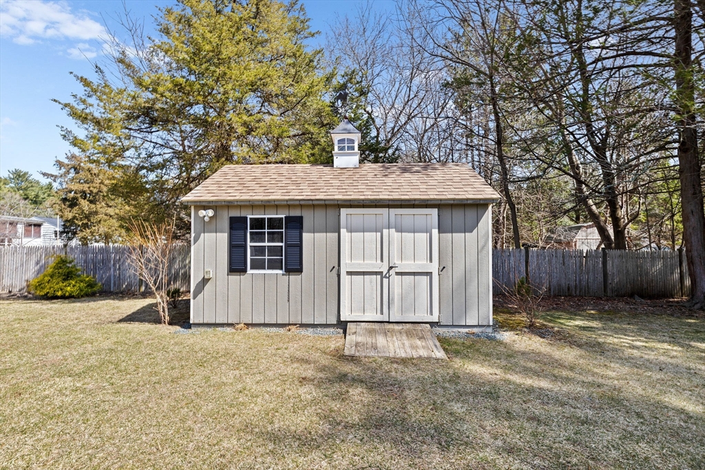 1368 Bay Road Stoughton, MA 02072 - Photo 33 of 42 a front view of a house with a yard
