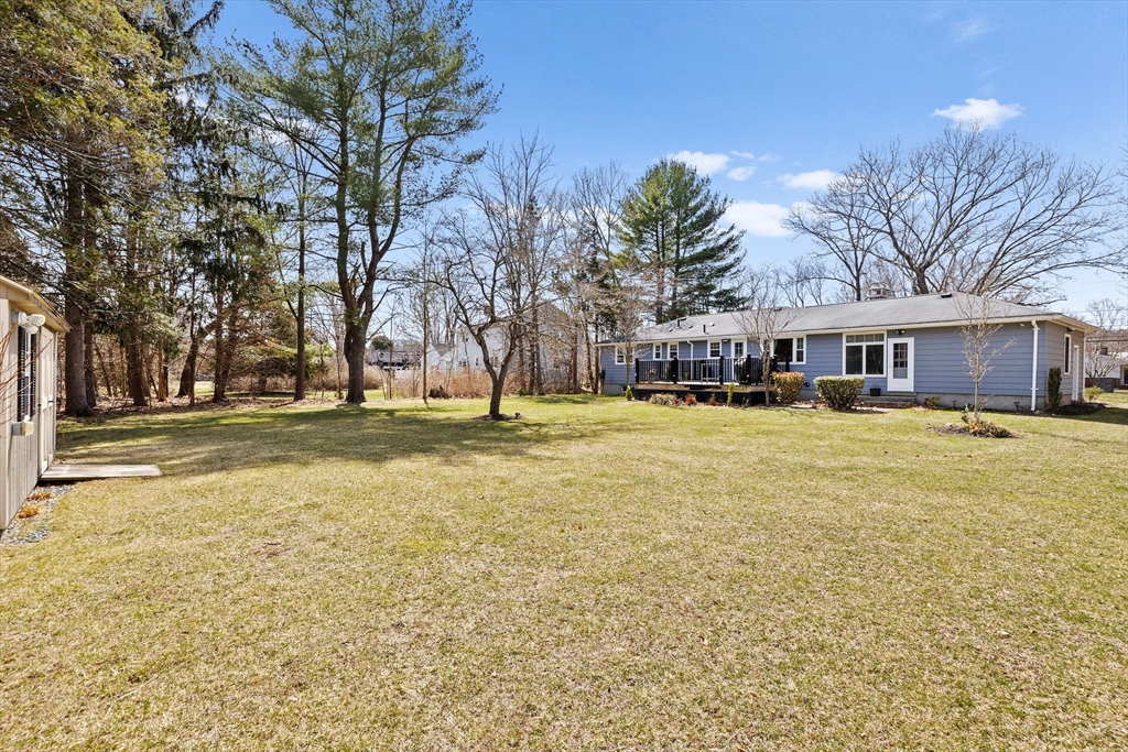 1368 Bay Road Stoughton, MA 02072 - Photo 34 of 42 a view of swimming pool with outdoor seating and house in the background