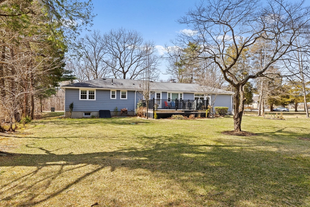 1368 Bay Road Stoughton, MA 02072 - Photo 36 of 42 a view of a swimming pool with a house in the background