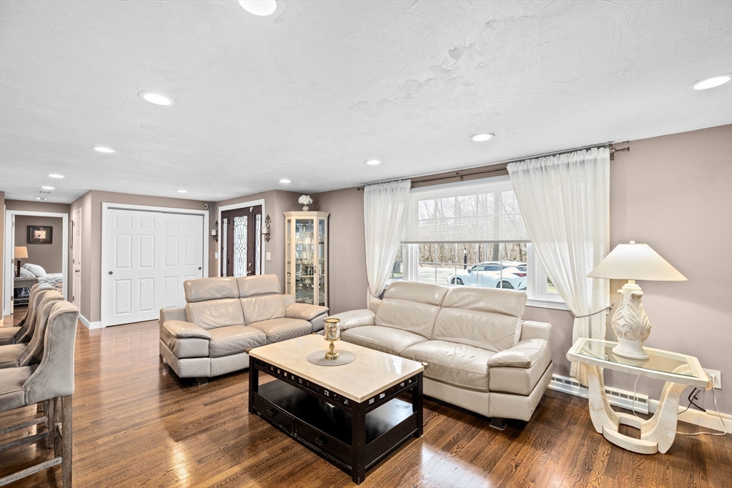 1368 Bay Road Stoughton, MA 02072 - Photo 4 of 42 a living room with furniture and a wooden floor