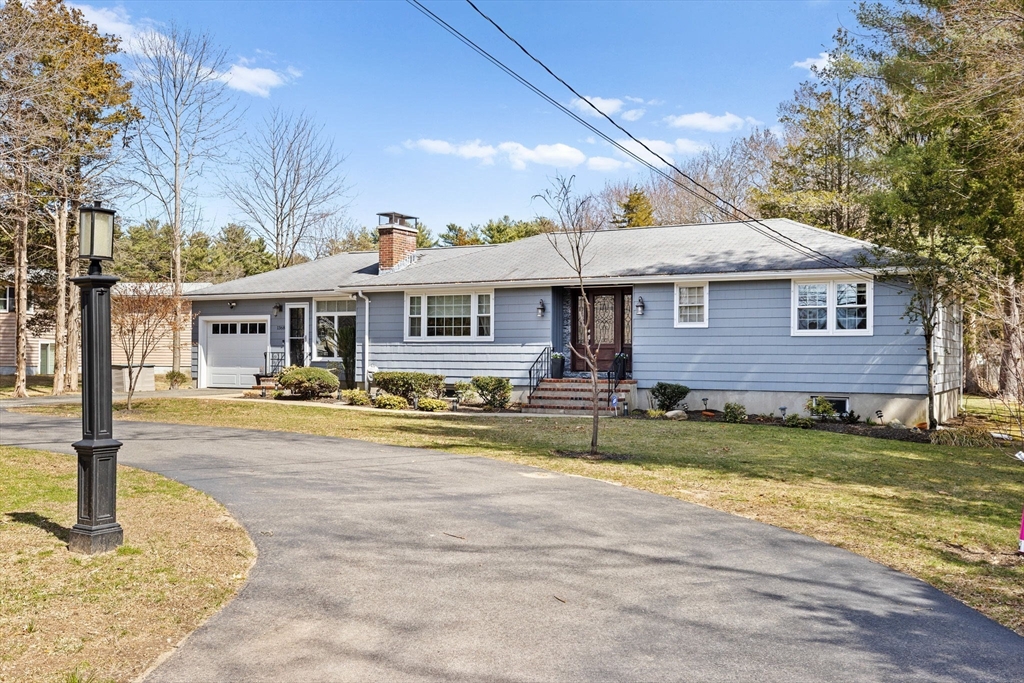 1368 Bay Road Stoughton, MA 02072 - Photo 42 of 42 a front view of a house with swimming pool and a yard