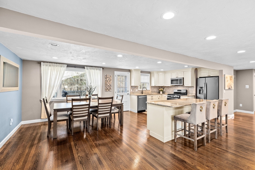 1368 Bay Road Stoughton, MA 02072 - Photo 9 of 42 a view of a dining room with furniture and wooden floor