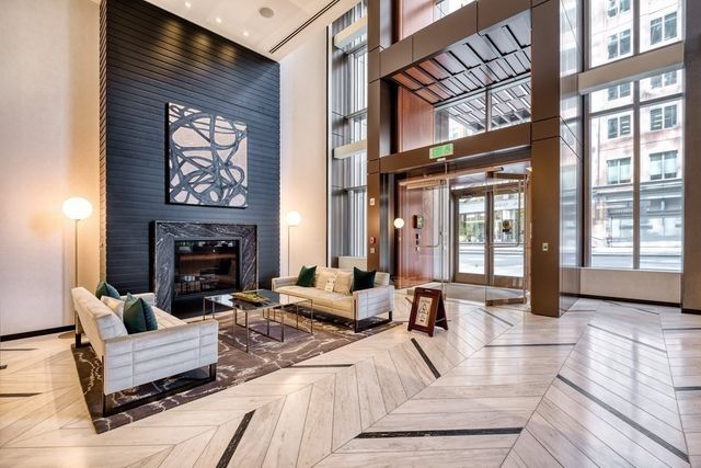 a bedroom with a bed and a mirror