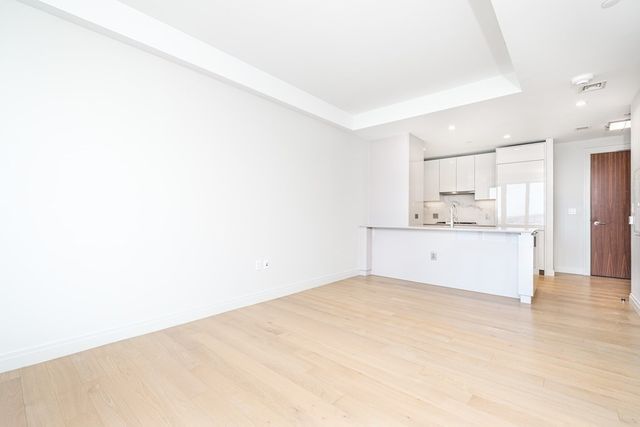 a view of kitchen with wooden floor