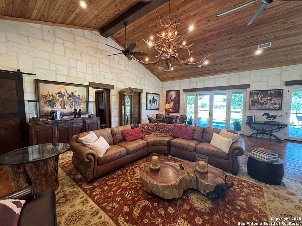 772 Luckenbach Road Fredericksburg, TX 78624 - Photo 15 of 86 a living room with furniture and a large window
