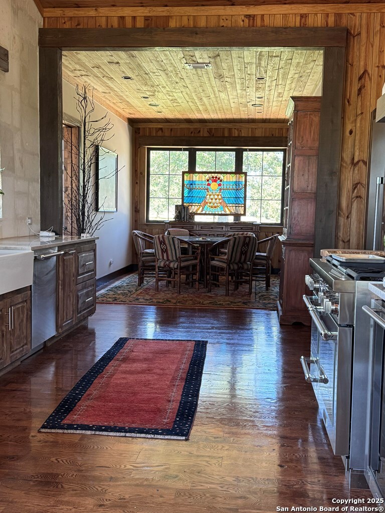 772 Luckenbach Road Fredericksburg, TX 78624 - Photo 20 of 86 a living room with fireplace furniture and a wooden floor