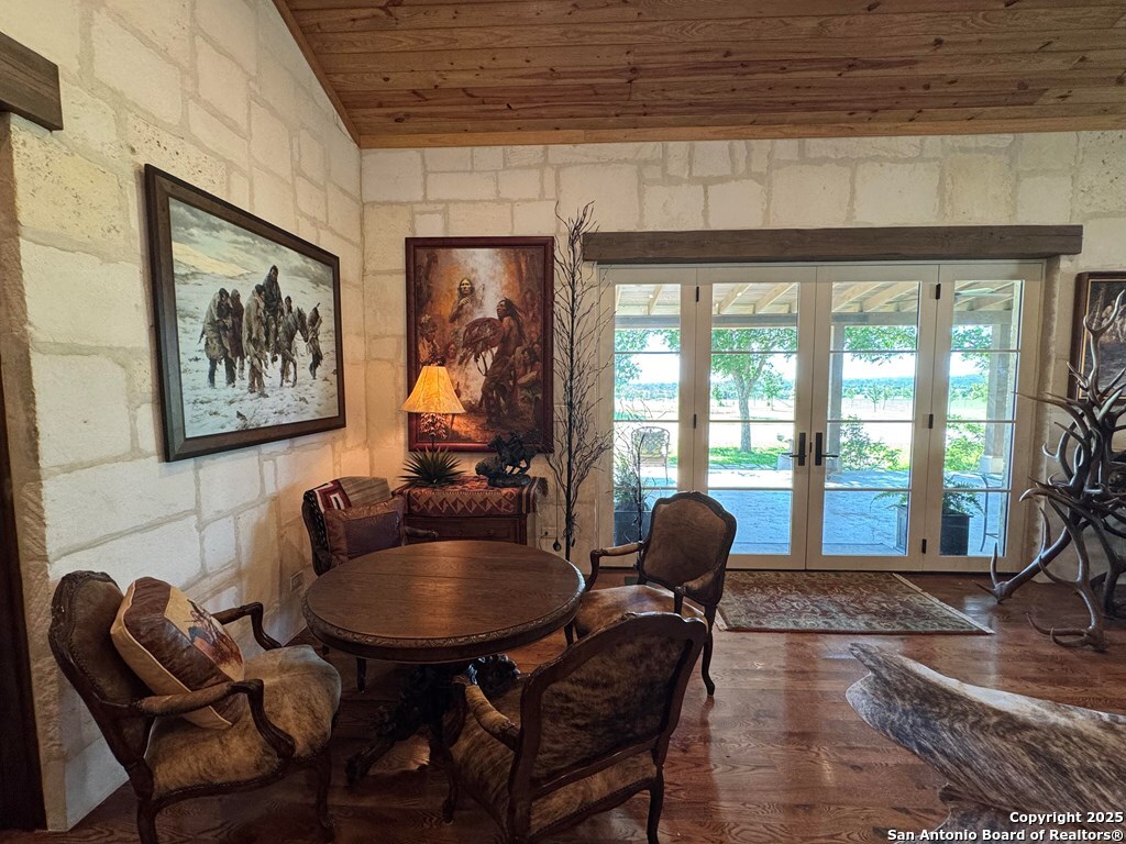 772 Luckenbach Road Fredericksburg, TX 78624 - Photo 27 of 86 a living room with furniture and a large window