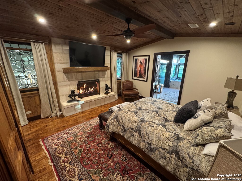 772 Luckenbach Road Fredericksburg, TX 78624 - Photo 30 of 86 a bed room with a bed and a large window