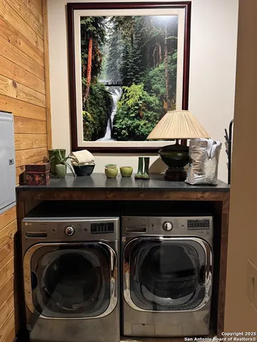 a bathroom with a shower sink and mirror