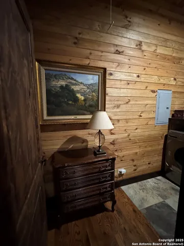 a view of a porch with furniture and a yard
