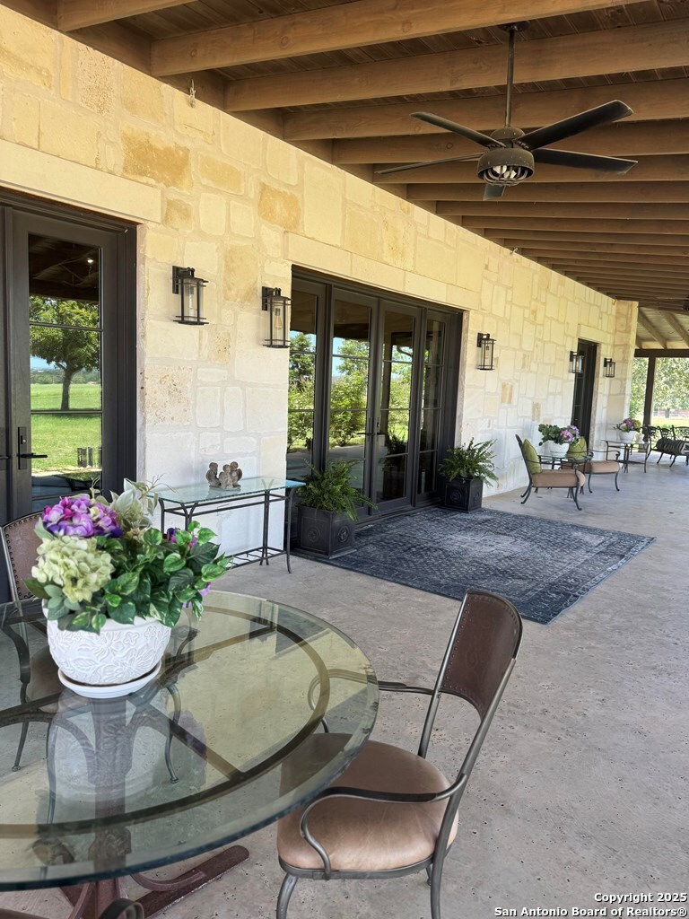 772 Luckenbach Road Fredericksburg, TX 78624 - Photo 4 of 86 a dining room with furniture and a potted plant