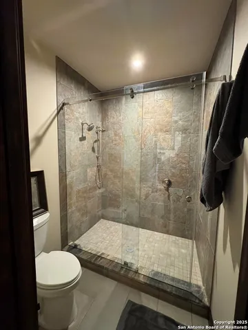 a view of a house with porch and garden