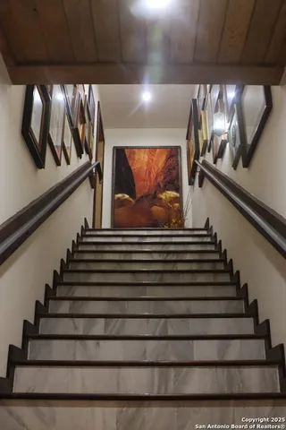 a view of a lake with houses in back