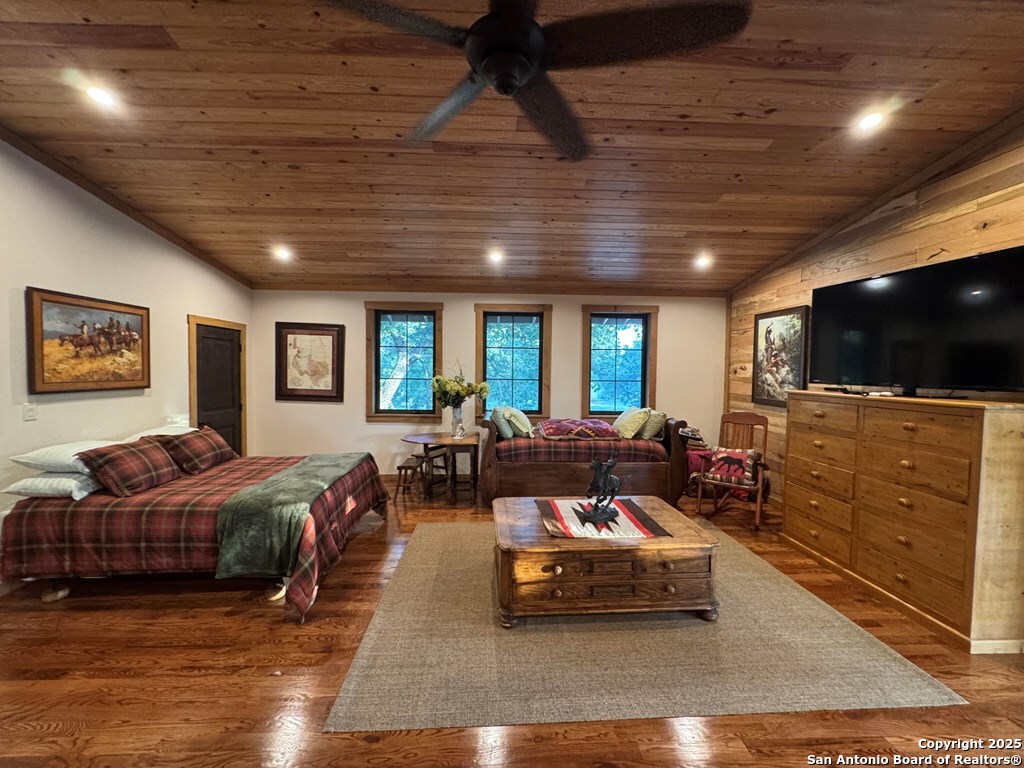 772 Luckenbach Road Fredericksburg, TX 78624 - Photo 48 of 86 a living room with furniture and a flat screen tv