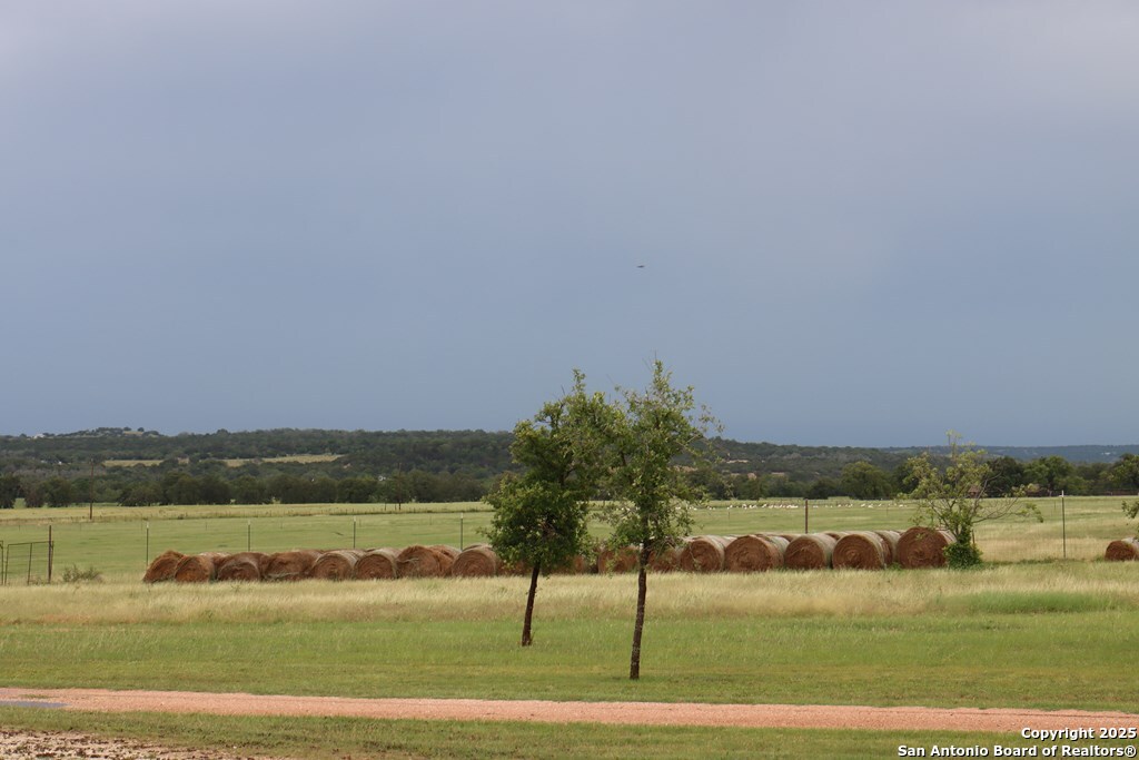 772 Luckenbach Road Fredericksburg, TX 78624 - Photo 65 of 86 a view of a lake with a yard